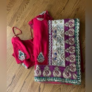 Red saree with matching blouse.